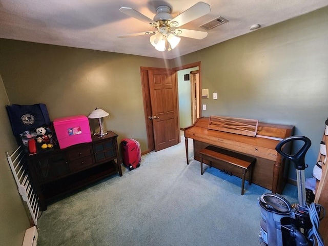 miscellaneous room with ceiling fan and light colored carpet