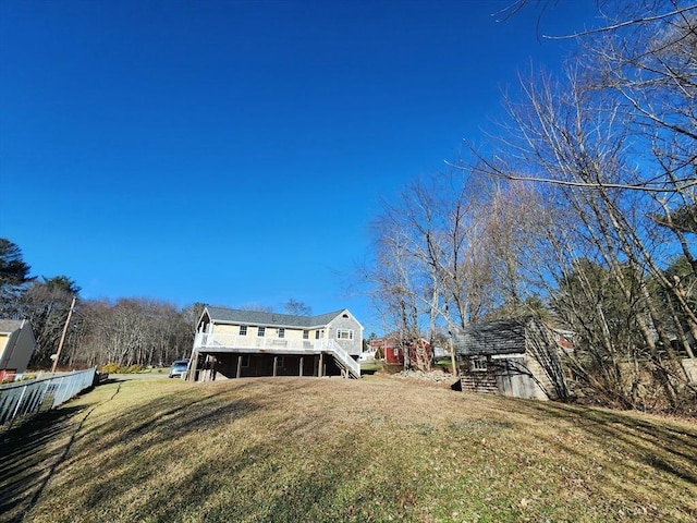 back of house with a lawn