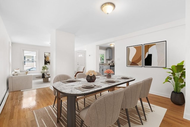 123 Ash St, New Bedford, MA 02740 - dining area with light wood-style floors and baseboards