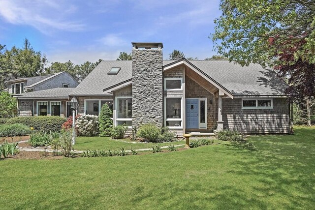 3 Down Harbor Rd, Edgartown, MA 02539 - view of front of house with a chimney, roof with shingles, and a front lawn