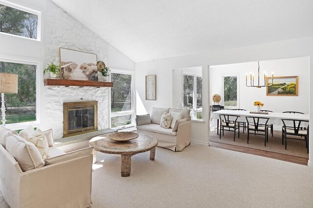 3 Down Harbor Rd, Edgartown, MA 02539 - living room featuring high vaulted ceiling, a fireplace, plenty of natural light, a chandelier, and carpet flooring