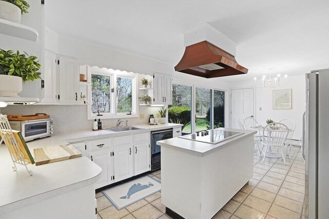3 Down Harbor Rd, Edgartown, MA 02539 - kitchen featuring black electric cooktop, dishwasher, a sink, a center island, and open shelves