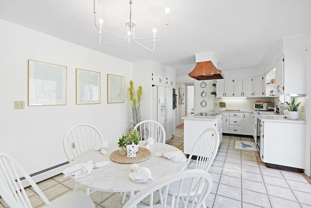 3 Down Harbor Rd, Edgartown, MA 02539 - dining area featuring a chandelier and light tile patterned floors