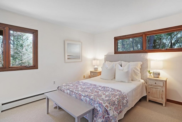 3 Down Harbor Rd, Edgartown, MA 02539 - bedroom with light colored carpet, a baseboard heating unit, and baseboards
