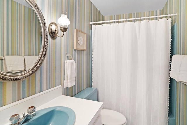 3 Down Harbor Rd, Edgartown, MA 02539 - bathroom featuring toilet, wallpapered walls, and vanity