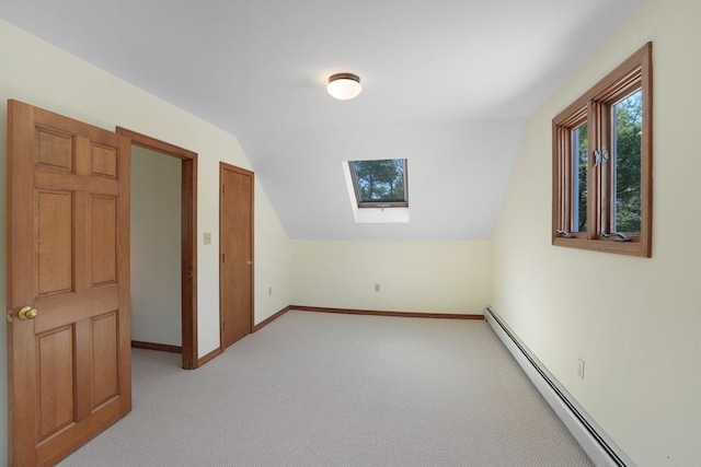 3 Down Harbor Rd, Edgartown, MA 02539 - additional living space with a baseboard radiator, a skylight, light colored carpet, baseboards, and vaulted ceiling