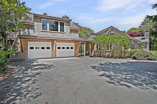 3 Down Harbor Rd, Edgartown, MA 02539 - shingle-style home featuring asphalt driveway, a garage, and stairway
