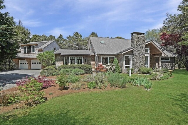 3 Down Harbor Rd, Edgartown, MA 02539 - shingle-style home with driveway, a front lawn, an attached garage, and a chimney