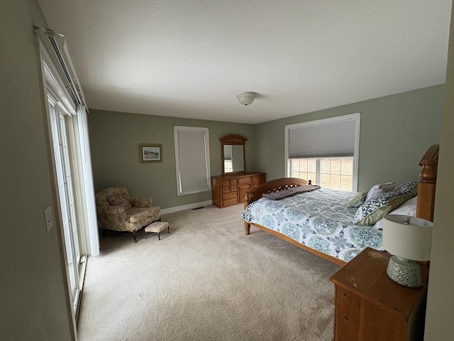 bedroom featuring light colored carpet