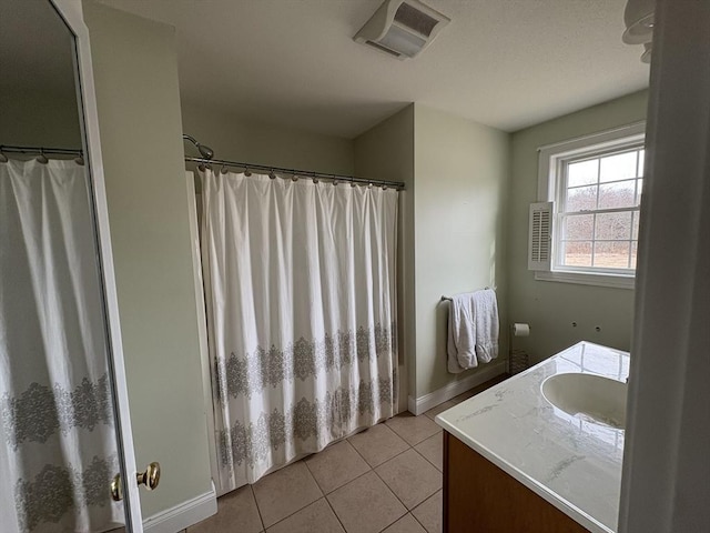 bathroom featuring vanity, tile patterned flooring, and a shower with curtain