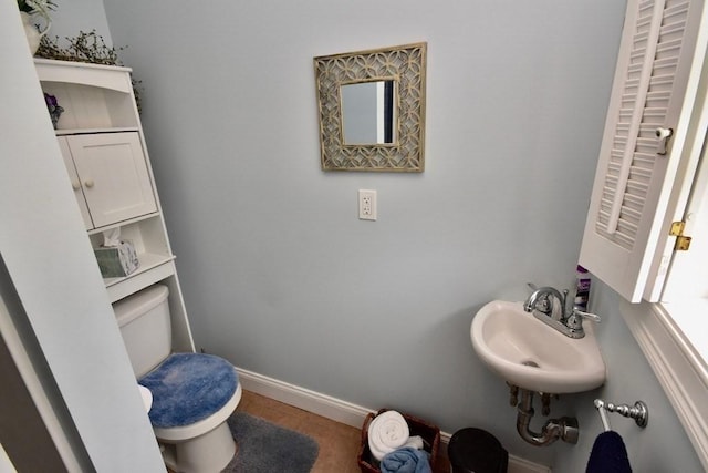 bathroom with sink and toilet