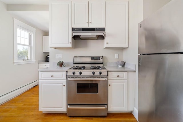 42 Lourdes Ave Unit 3, Boston, MA 02130 - kitchen with appliances with stainless steel finishes, under cabinet range hood, white cabinetry, light countertops, and light wood-type flooring