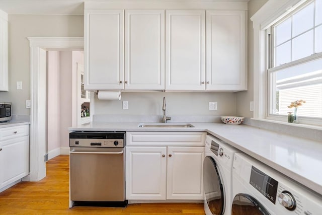 42 Lourdes Ave Unit 3, Boston, MA 02130 - kitchen featuring stainless steel appliances, white cabinetry, light countertops, light wood-style flooring, and independent washer and dryer