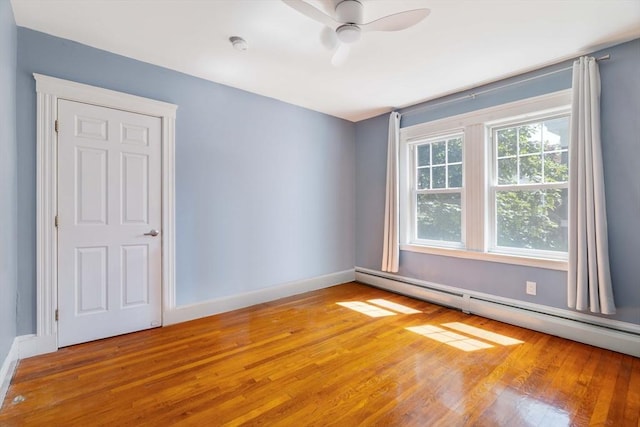 42 Lourdes Ave Unit 3, Boston, MA 02130 - spare room featuring a baseboard heating unit, light wood-style flooring, ceiling fan, and a smoke detector