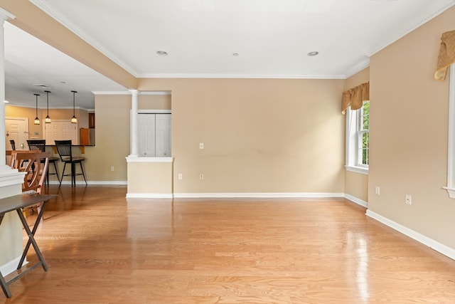 190 Chickering Rd Unit 201D, North Andover, MA 01845 - unfurnished living room featuring light wood-type flooring, crown molding, baseboards, ornate columns, and recessed lighting