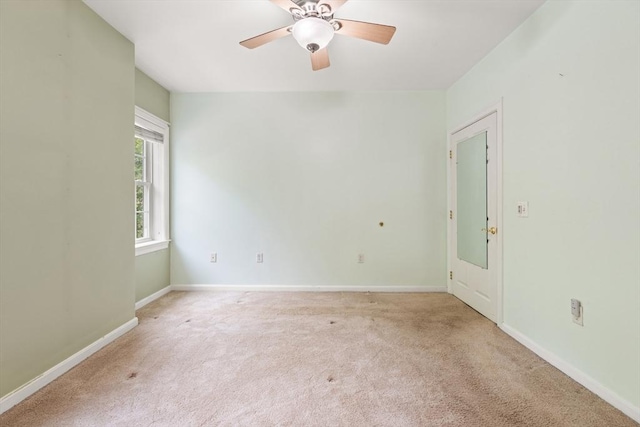190 Chickering Rd Unit 201D, North Andover, MA 01845 - spare room featuring light carpet, ceiling fan, and baseboards