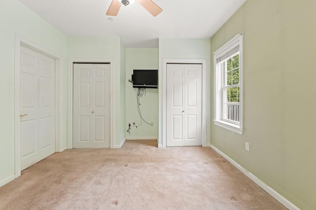 190 Chickering Rd Unit 201D, North Andover, MA 01845 - unfurnished bedroom featuring carpet floors, baseboards, two closets, and ceiling fan