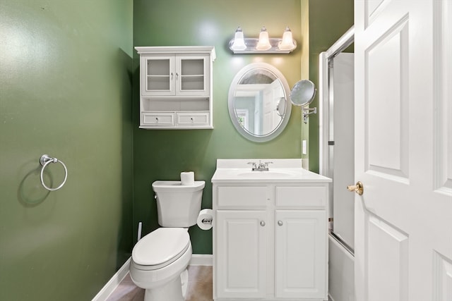 190 Chickering Rd Unit 201D, North Andover, MA 01845 - bathroom with toilet, vanity, and baseboards