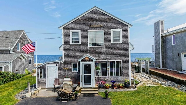 36 Ocean St, Marshfield, MA 02050 - view of front of home featuring a water view, a patio area, and a front yard