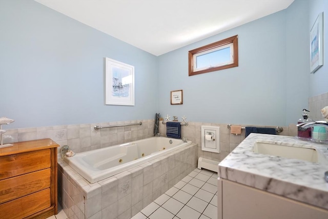 36 Ocean St, Marshfield, MA 02050 - bathroom featuring a tub with jets, vanity, tile patterned flooring, tile walls, and wainscoting