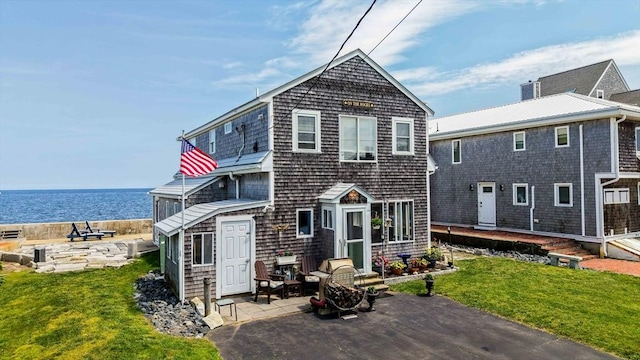 36 Ocean St, Marshfield, MA 02050 - back of house featuring a patio, a water view, and a yard