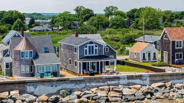 36 Ocean St, Marshfield, MA 02050 - back of house with a chimney, a shingled roof, and a wooden deck