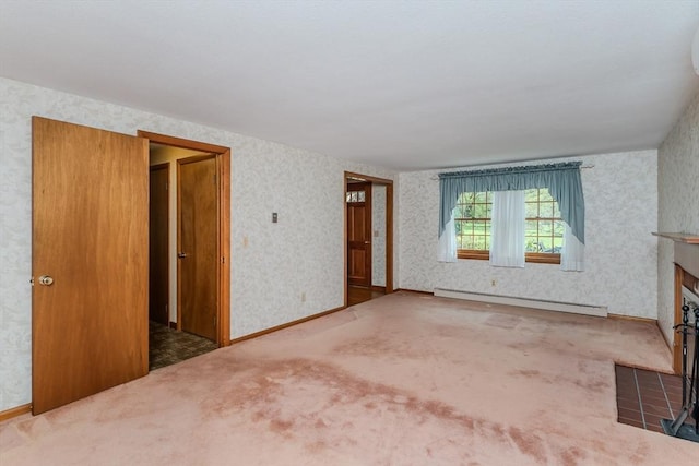 unfurnished living room featuring an AC wall unit, carpet, wallpapered walls, a fireplace with flush hearth, and a baseboard radiator