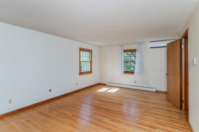 unfurnished bedroom featuring light wood-style floors, baseboards, a baseboard radiator, and a wall mounted air conditioner