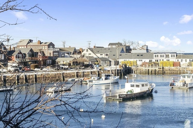 view of dock featuring a water view and a residential view