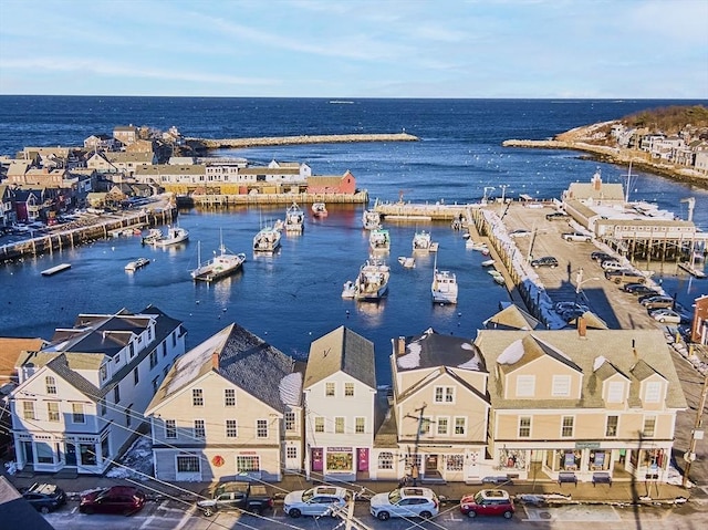 birds eye view of property with a water view and a residential view