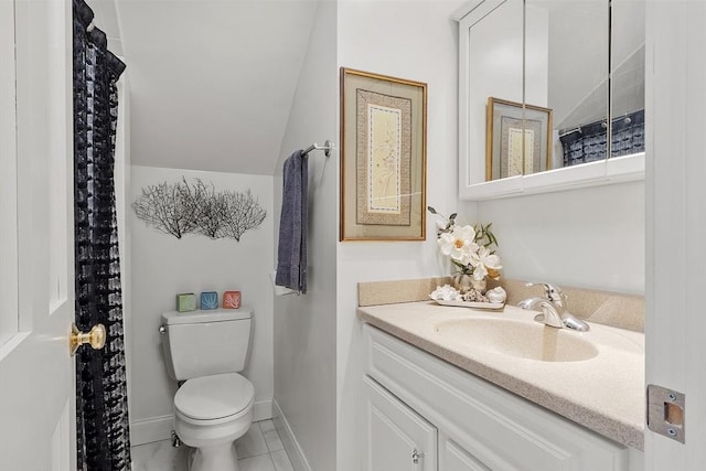 bathroom featuring baseboards, toilet, tile patterned flooring, vaulted ceiling, and vanity