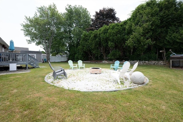 11 Ann Ave, Dartmouth, MA 02747 - view of grassy yard with a fire pit and a wooden deck
