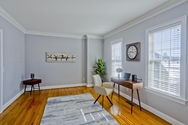 home office featuring crown molding, wood finished floors, visible vents, and baseboards