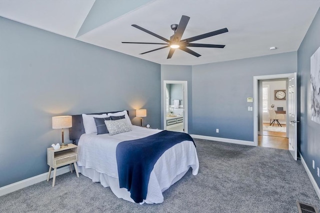 carpeted bedroom with visible vents, ceiling fan, and baseboards