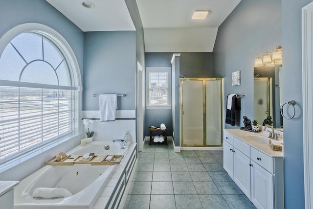 full bathroom with lofted ceiling, tile patterned flooring, vanity, a jetted tub, and a shower stall