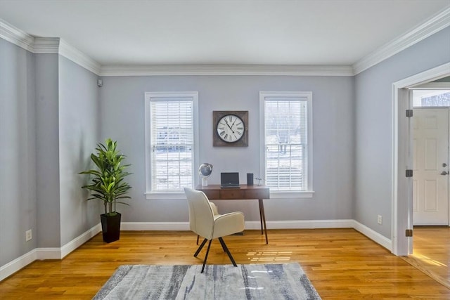 office with ornamental molding, baseboards, and wood finished floors