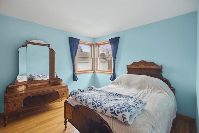 bedroom with wood finished floors