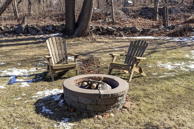 view of yard with a fire pit