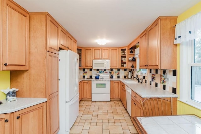 kitchen with sink and white appliances