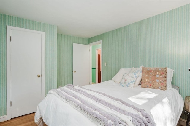 bedroom with light hardwood / wood-style floors