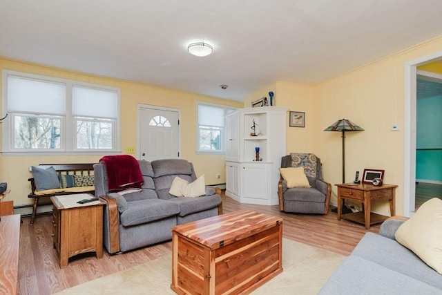 living room featuring light hardwood / wood-style floors and baseboard heating