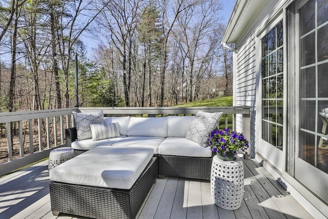 wooden terrace featuring an outdoor living space