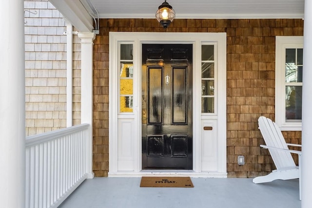 doorway to property with a porch