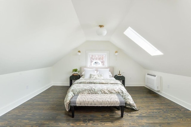 bedroom with vaulted ceiling with skylight, baseboards, and wood finished floors