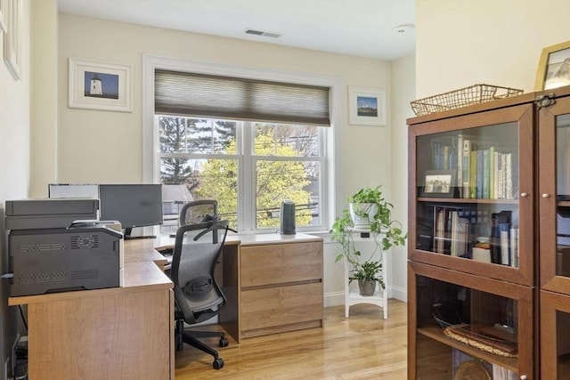 home office with visible vents and light wood finished floors