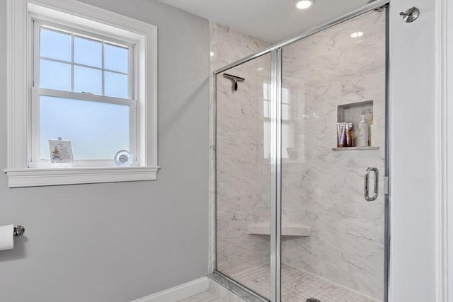 bathroom with baseboards, recessed lighting, and a stall shower