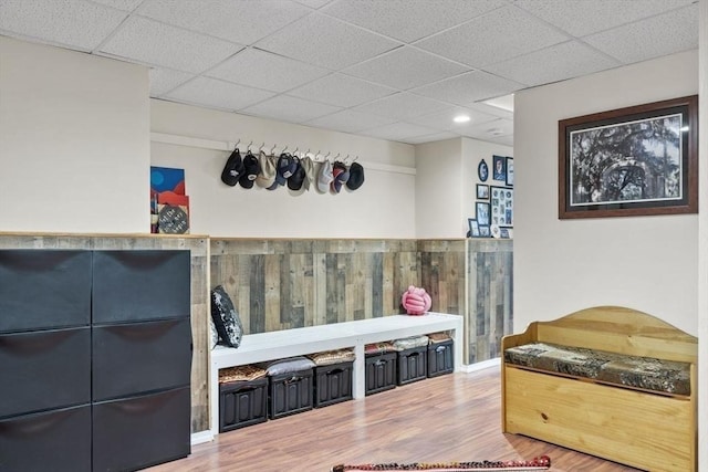 interior space with recessed lighting, a drop ceiling, and wood finished floors