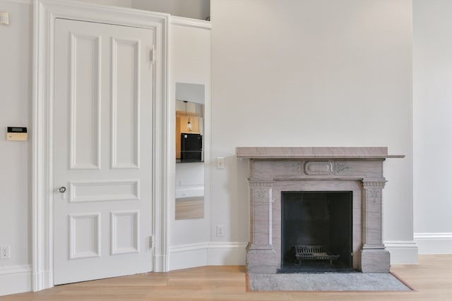 unfurnished living room with light wood-type flooring