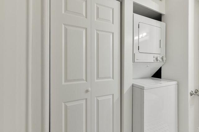 washroom with stacked washer and clothes dryer