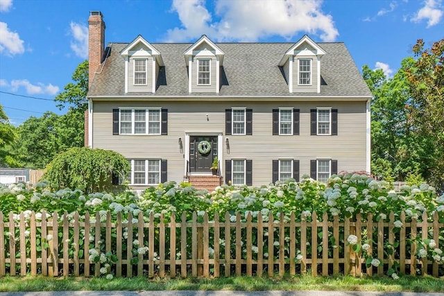 69 Kame St, Brockton, MA 02302 - view of front of house with a chimney and roof with shingles